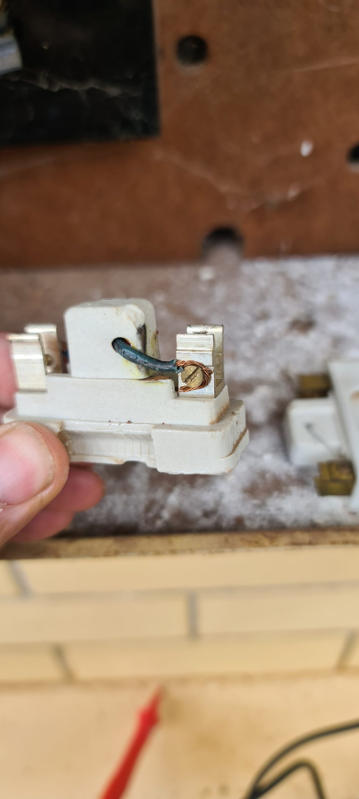 A close-up of ceramic fuses used in electrical systems, showcasing reliable components for switchboard upgrades