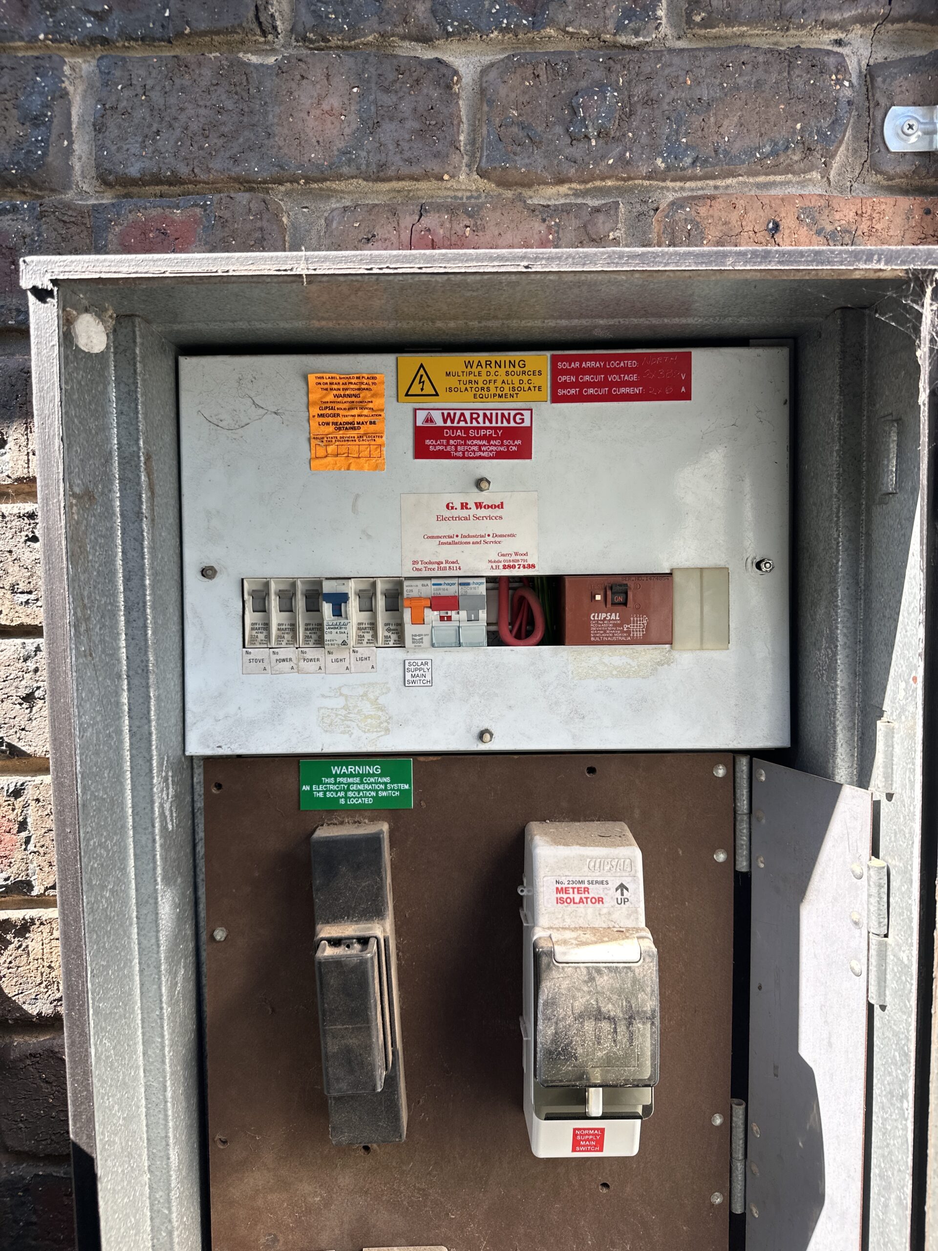 High-voltage electrical switchboard showing electrical wiring, circuit breakers, and surge protection for safe electrical installations. Title: Electrical power switchboard and wiring by master electricians.