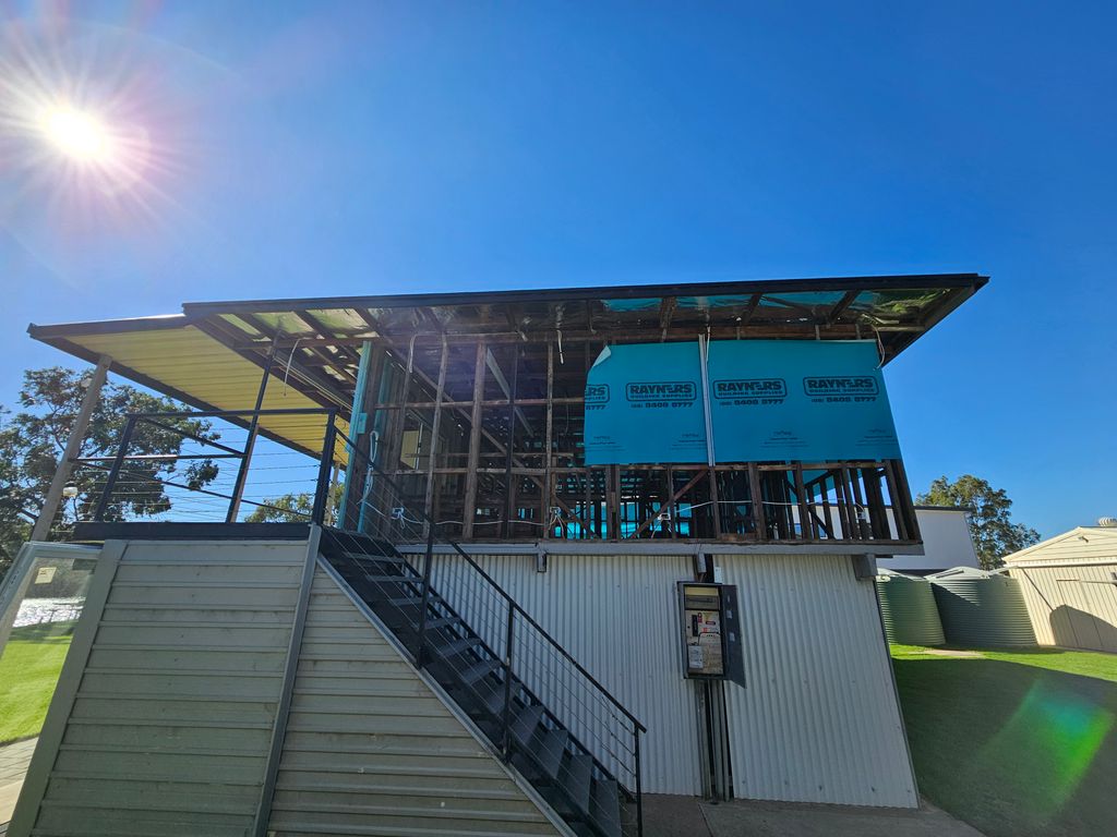 Electrician installing wiring during renovation for modern design home in Bowhill