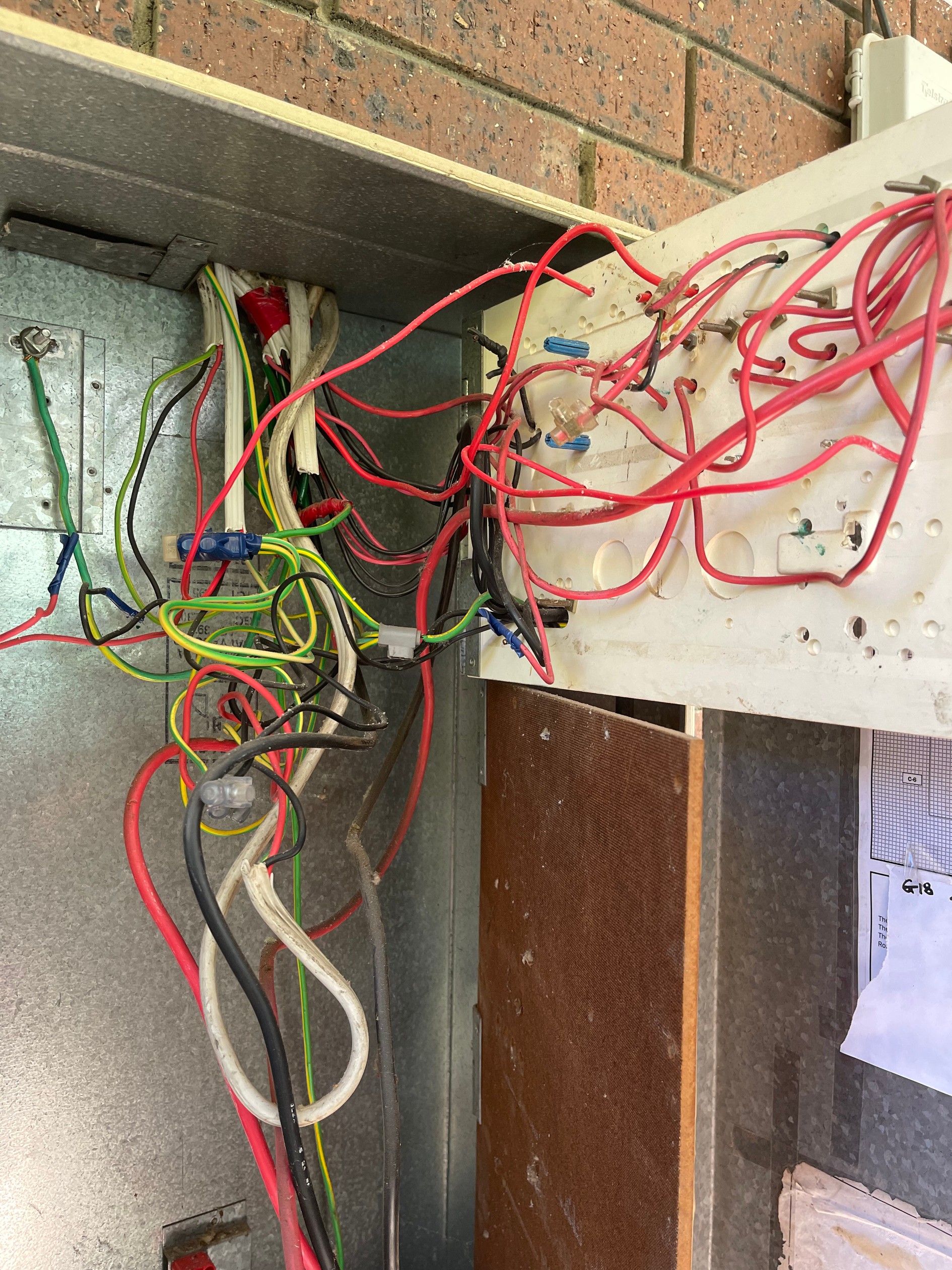 Old ceramic fuses in a Salisbury electrical switchboard before a switchboard upgrade